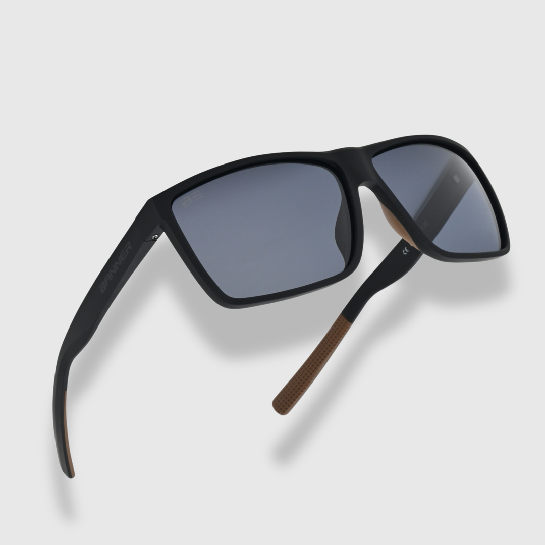 RANGERS ONYX sunglasses with a gray gradient lens on a light gray background
