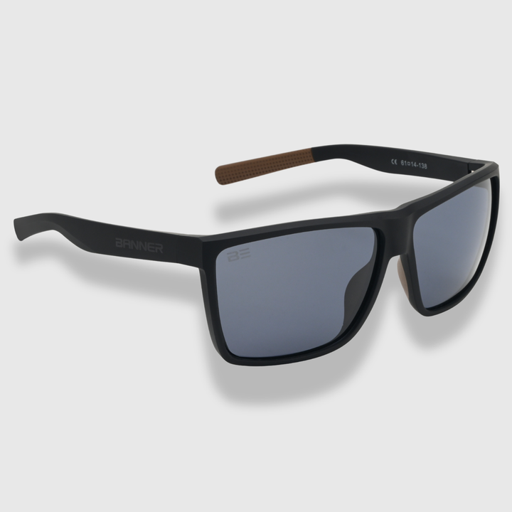 RANGERS ONYX sunglasses with a gray gradient lens on a light gray background