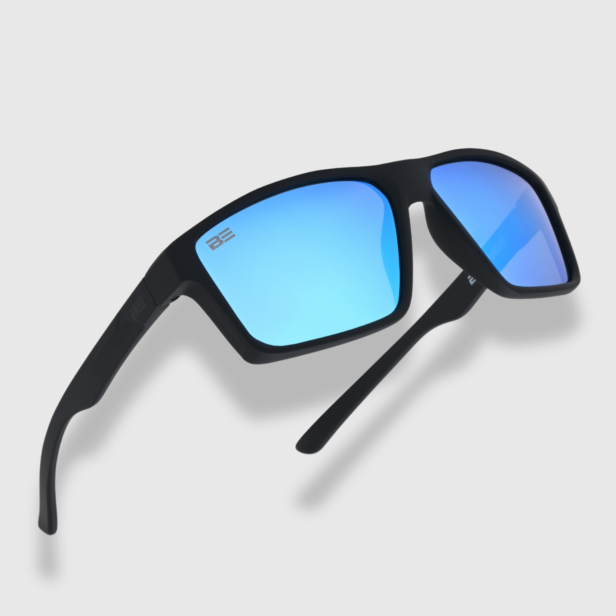 VALOR ARCTIC sunglasses with a blue gradient lens on a light gray background