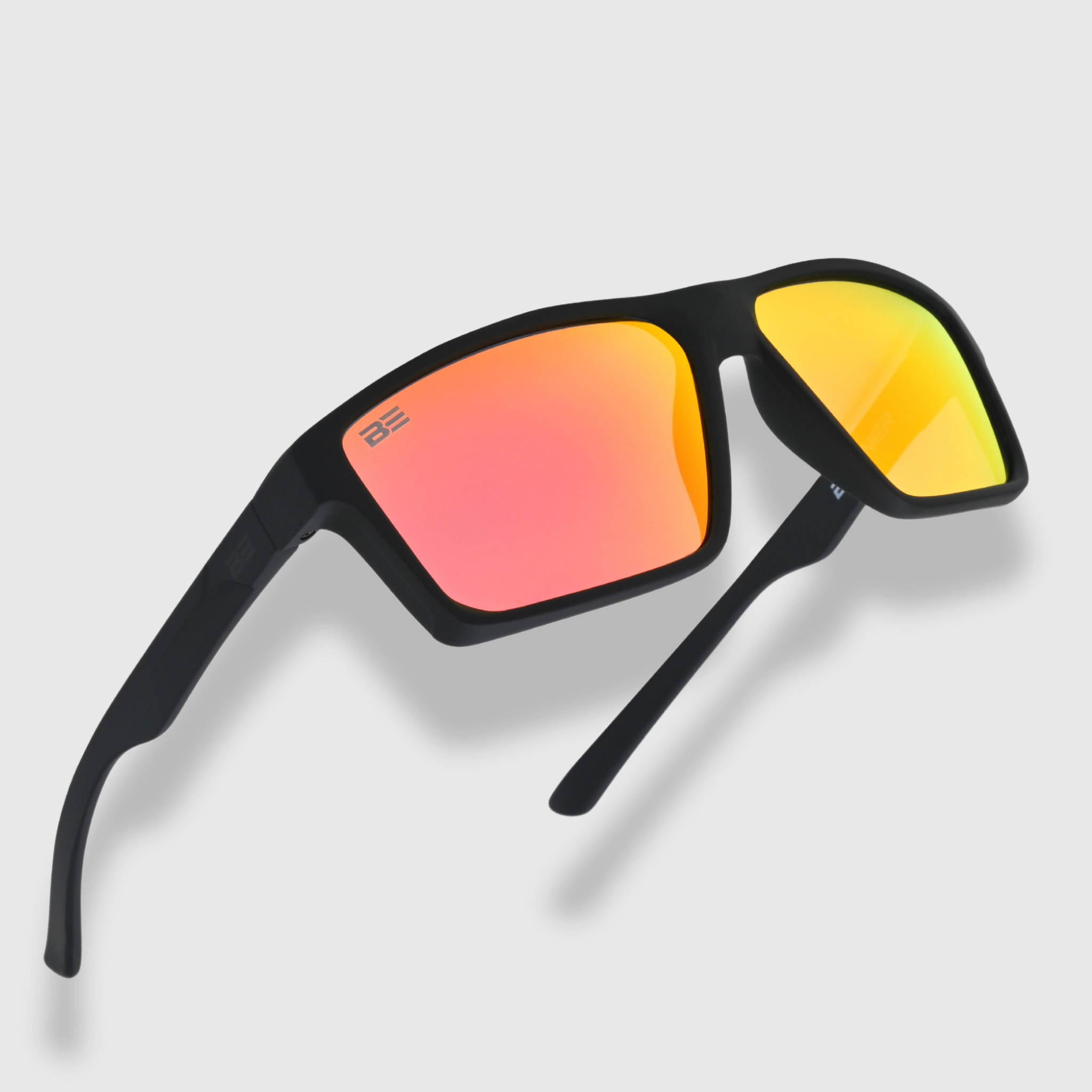 VALOR CRIMSON sunglasses with a red orange gradient lens on a light gray background