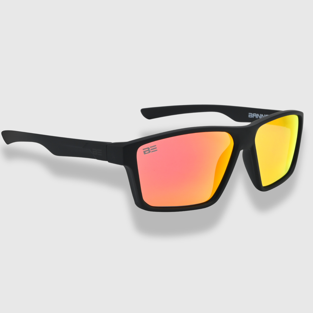 VALOR CRIMSON sunglasses with a red orange gradient lens on a light gray background