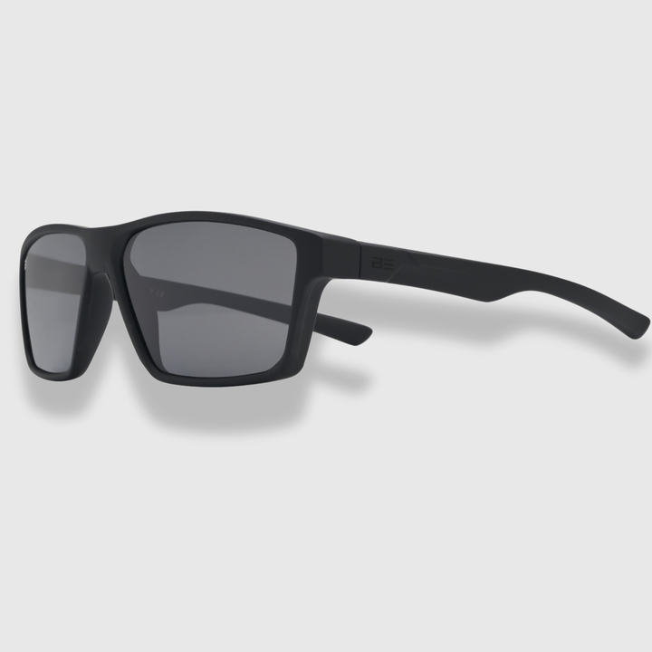 VALOR ONYX sunglasses with gray gradient lens on a light gray background