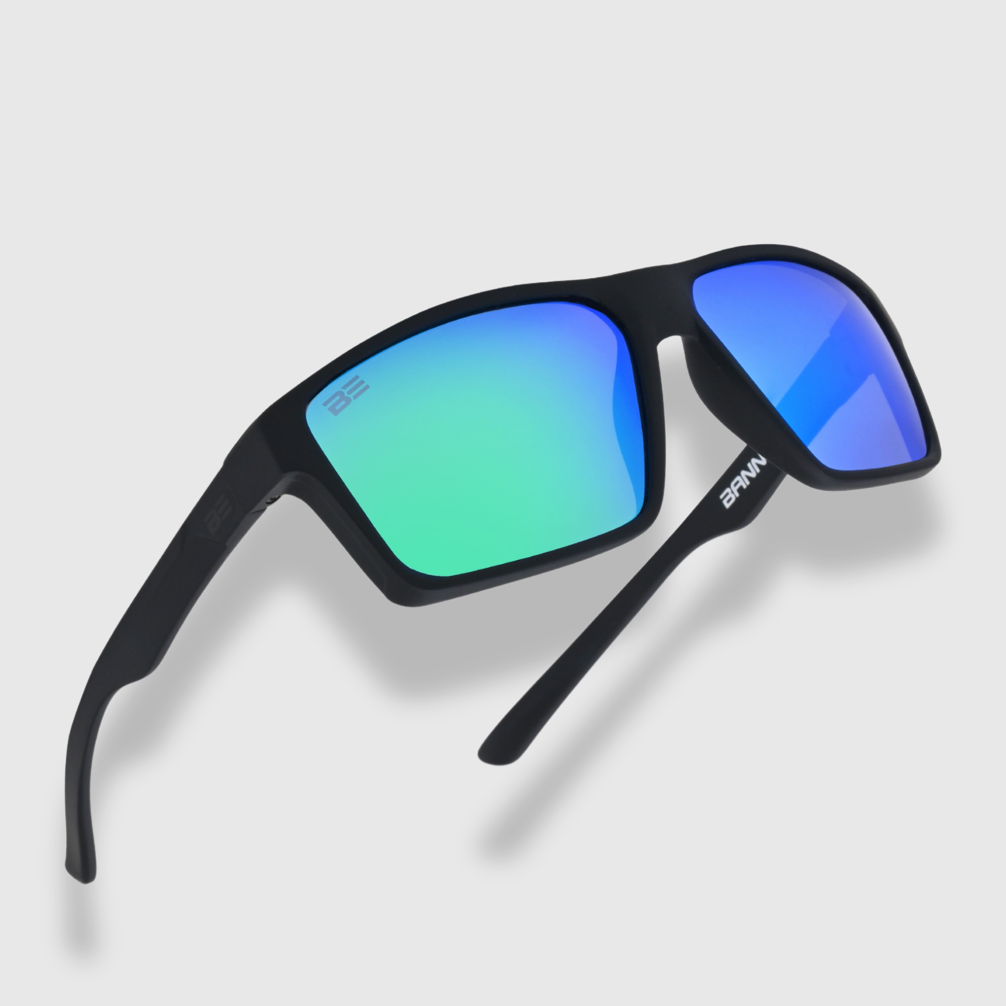 VALOR RECON sunglasses with a green blue gradient lens on a light gray background