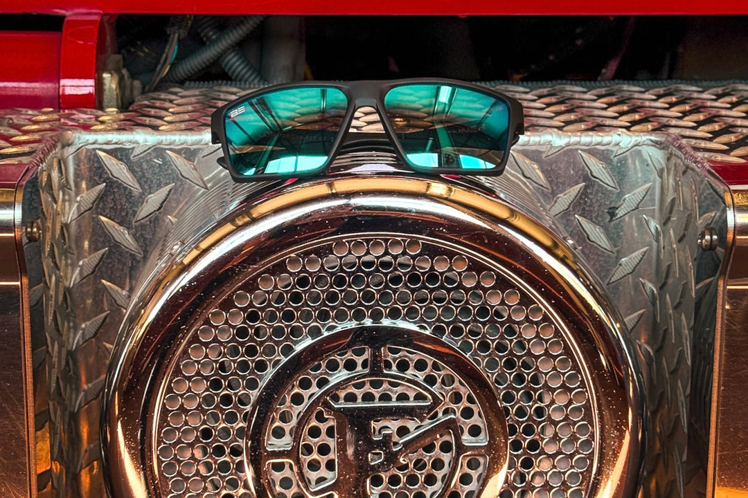 Close up of Banner VALOR sunglasses sitting on a red firetruck