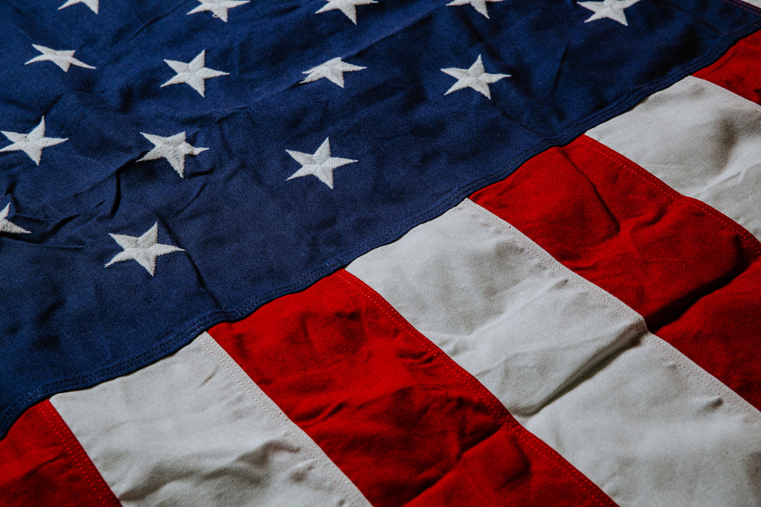 Close-up of an American flag with stars and stripes.