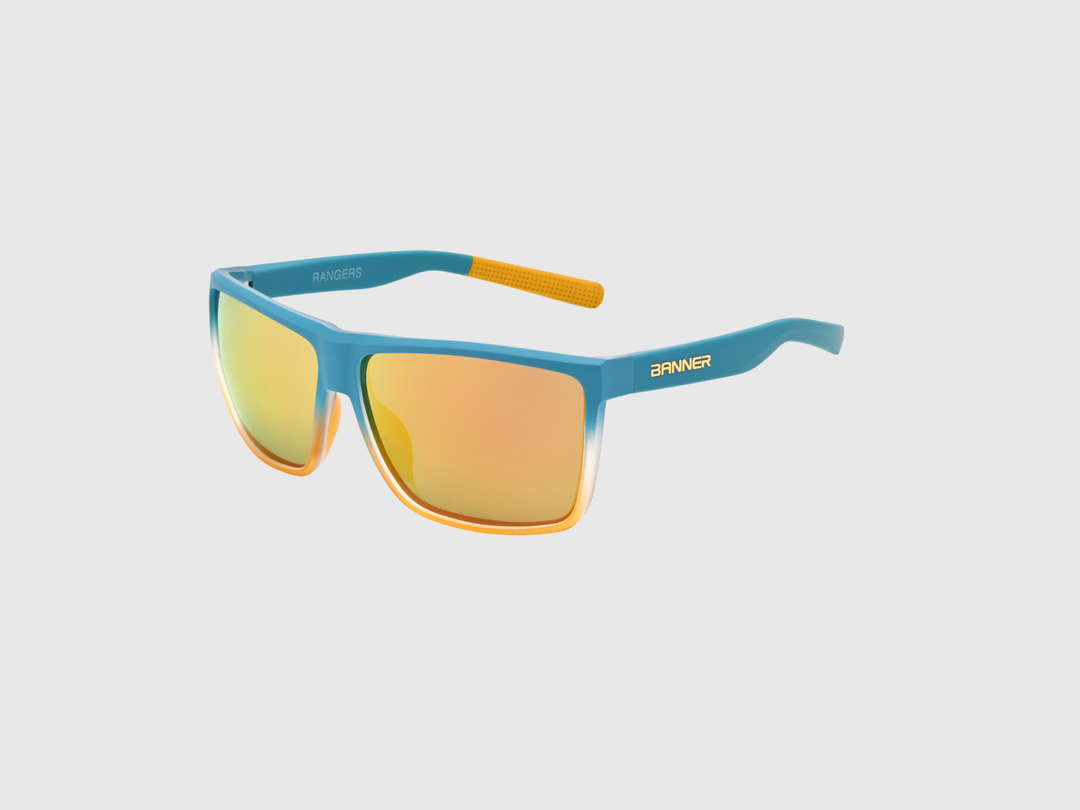 RANGERS BRONZE sunglasses with a orange bronze gradient lens on a light gray background