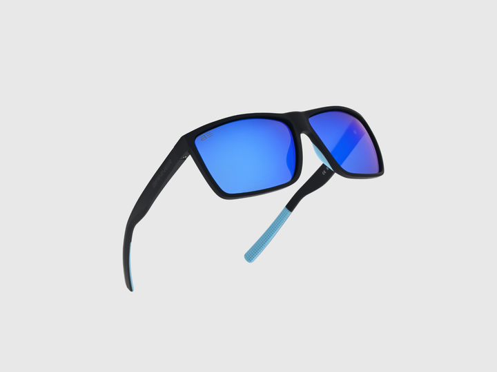RANGERS COBALT sunglasses with a blue gradient lens on a light gray background