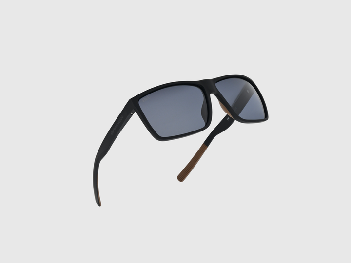 RANGERS ONYX sunglasses with a gray gradient lens on a light gray background