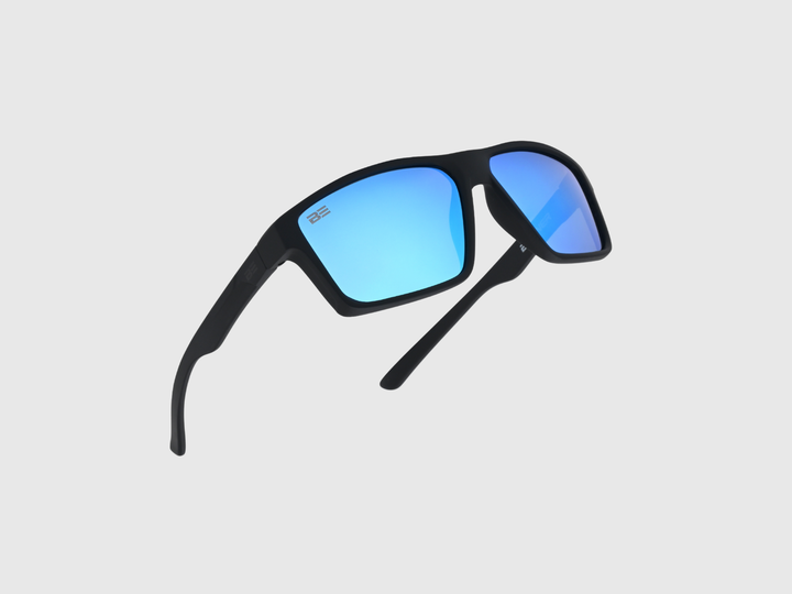 VALOR ARCTIC sunglasses with a blue gradient lens on a light gray background