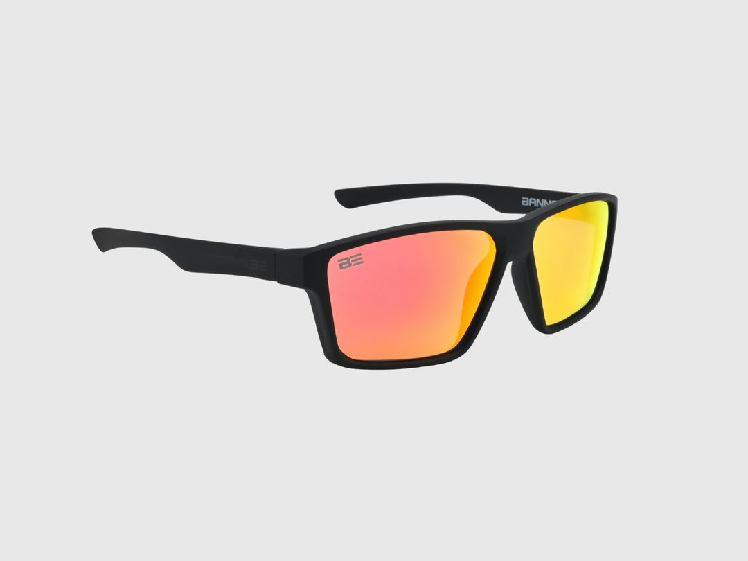 VALOR CRIMSON sunglasses with a red orange gradient lens on a light gray background