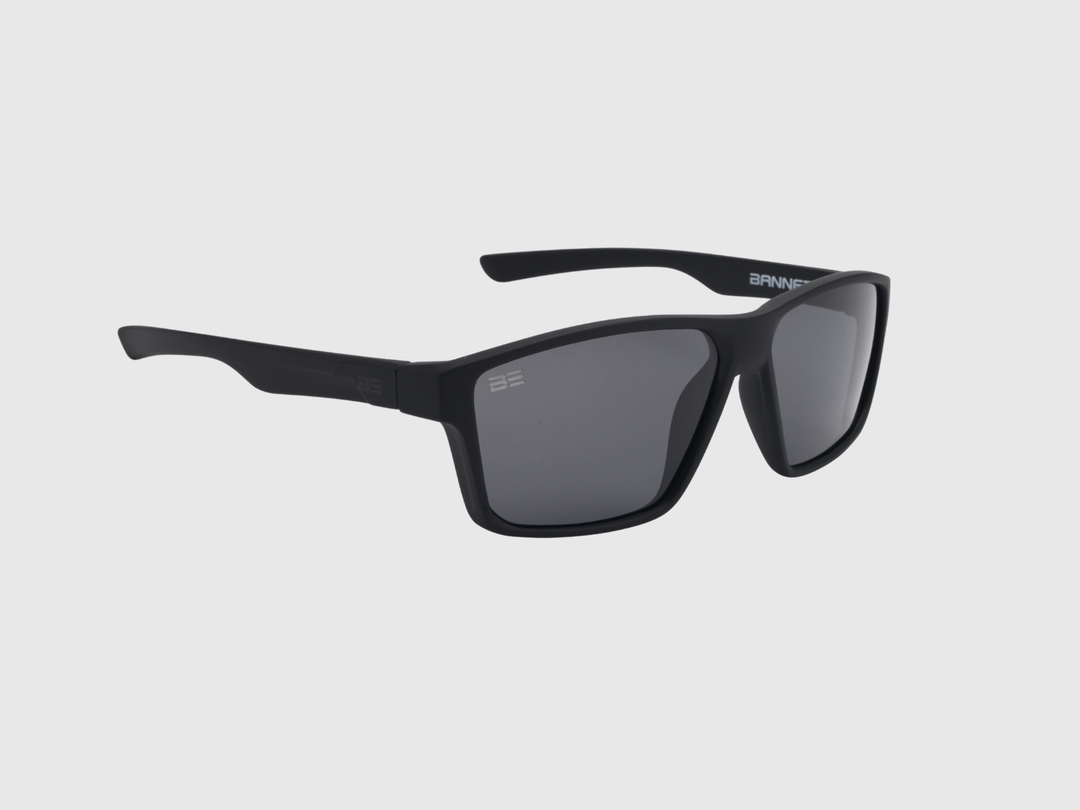 VALOR ONYX sunglasses with gray gradient lens on a light gray background