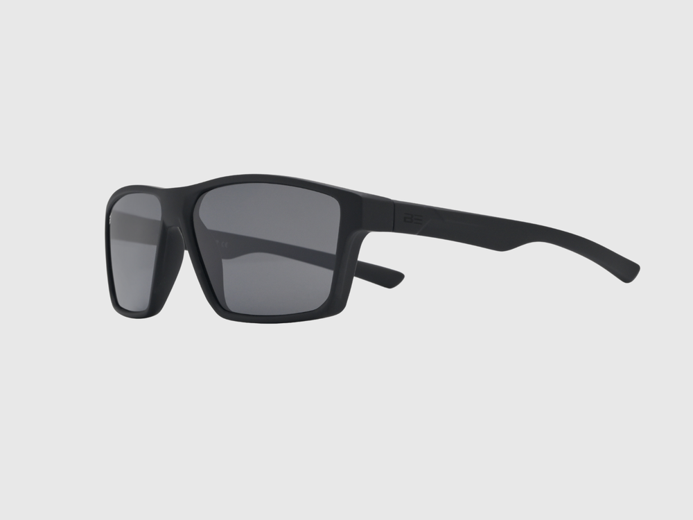 VALOR ONYX sunglasses with gray gradient lens on a light gray background