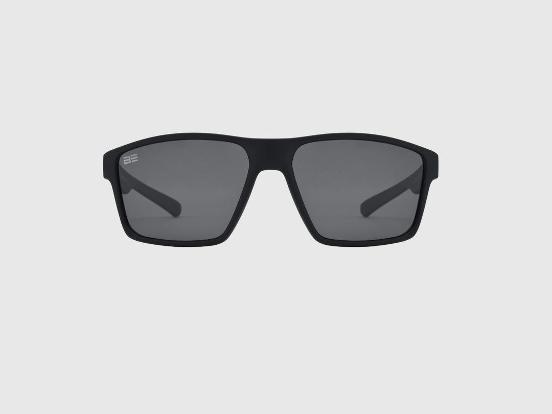 VALOR ONYX sunglasses with gray gradient lens on a light gray background