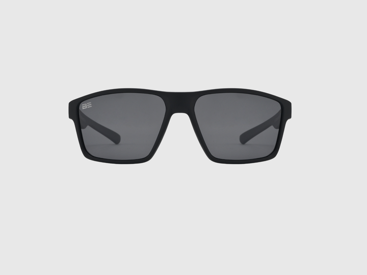 VALOR ONYX sunglasses with gray gradient lens on a light gray background