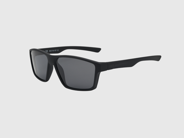 VALOR ONYX sunglasses with gray gradient lens on a light gray background