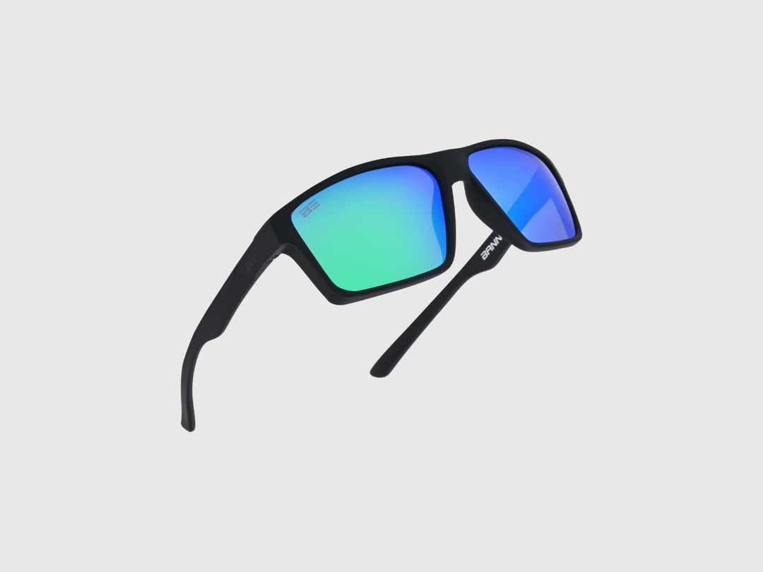 VALOR RECON sunglasses with a green blue gradient lens on a light gray background